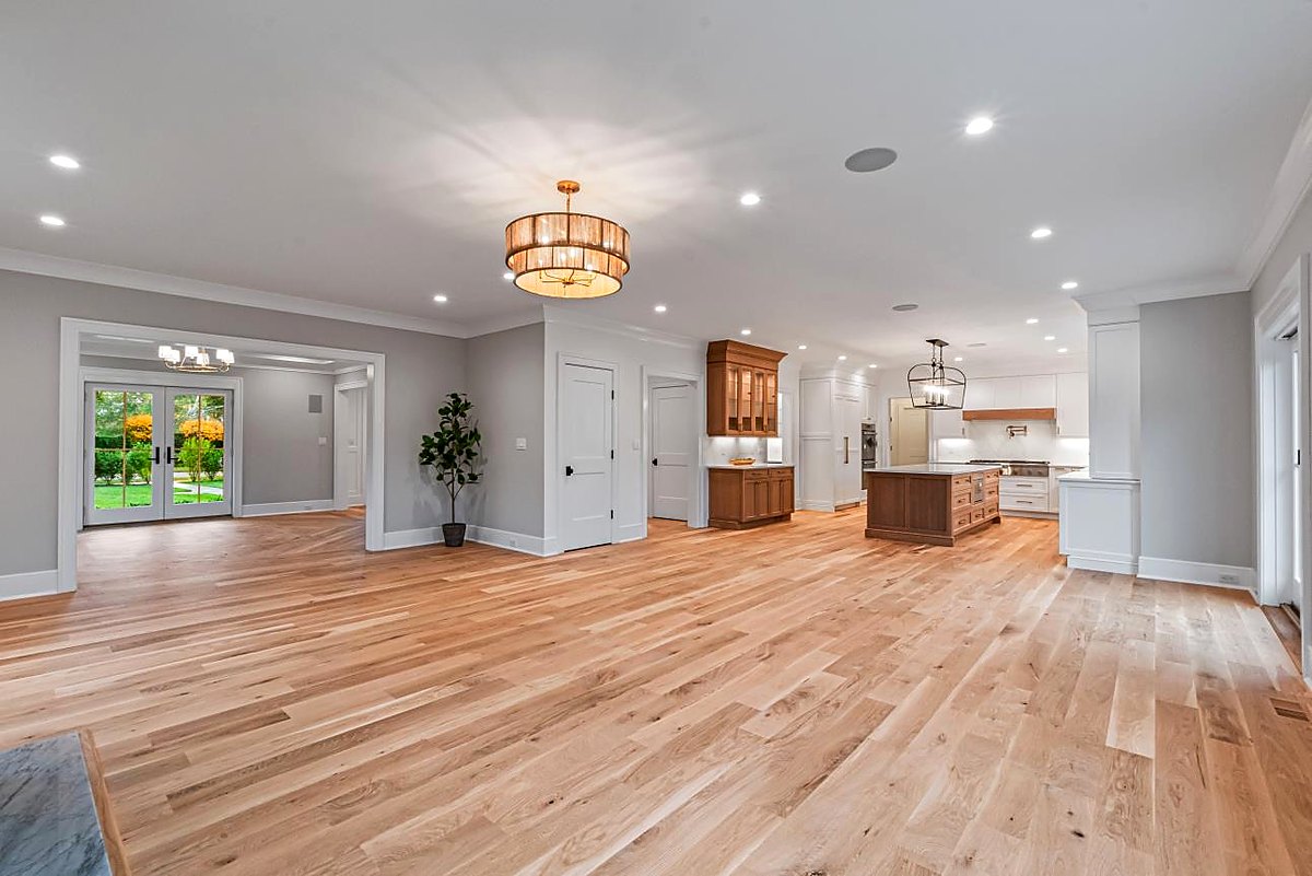 Great room opening to the kitchen with a lantern pendant over the island