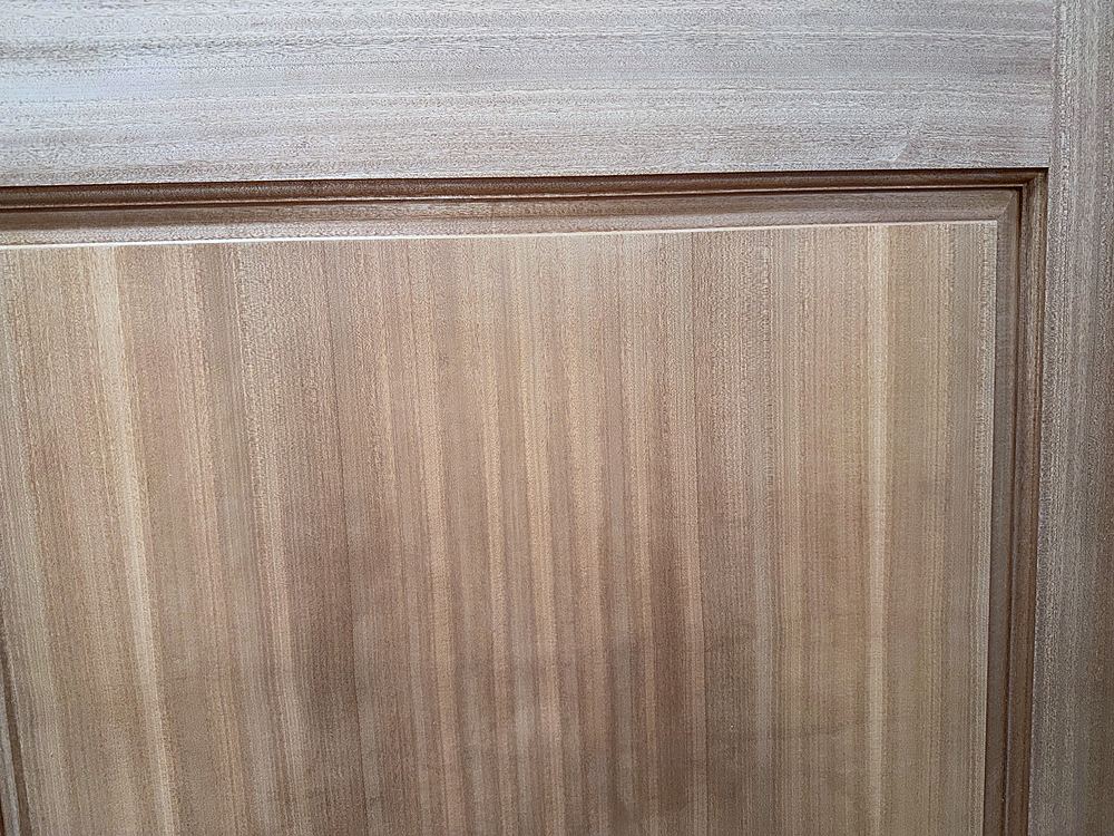 Close view of a mahogany door rail and stile joint