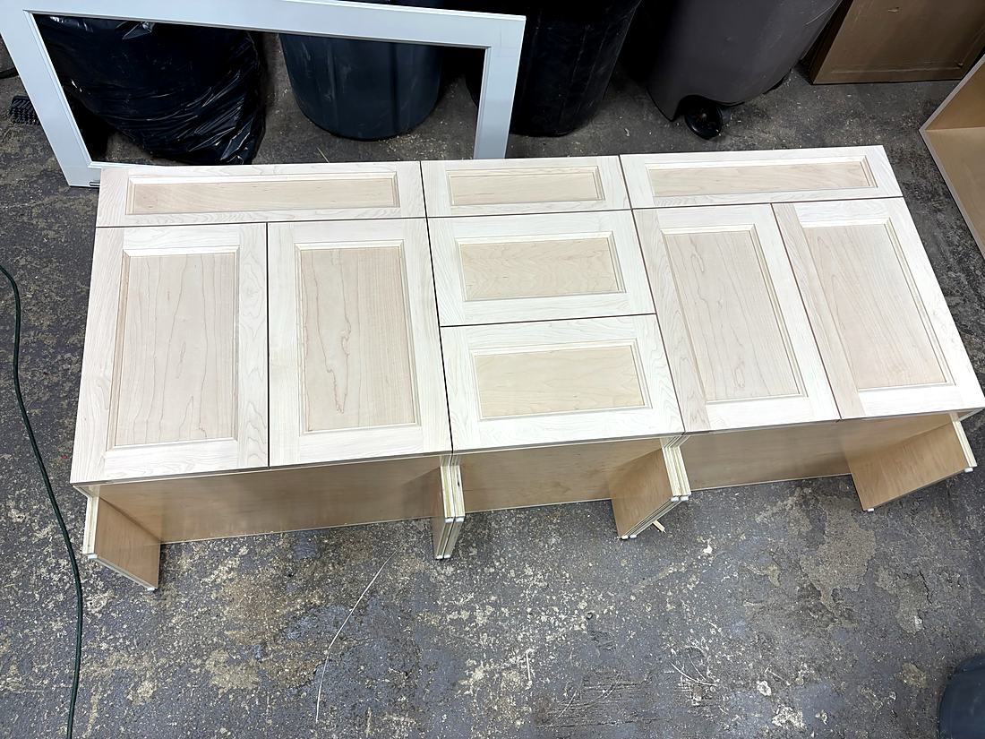 Raised panel door laid out on the bench in the millwork shop