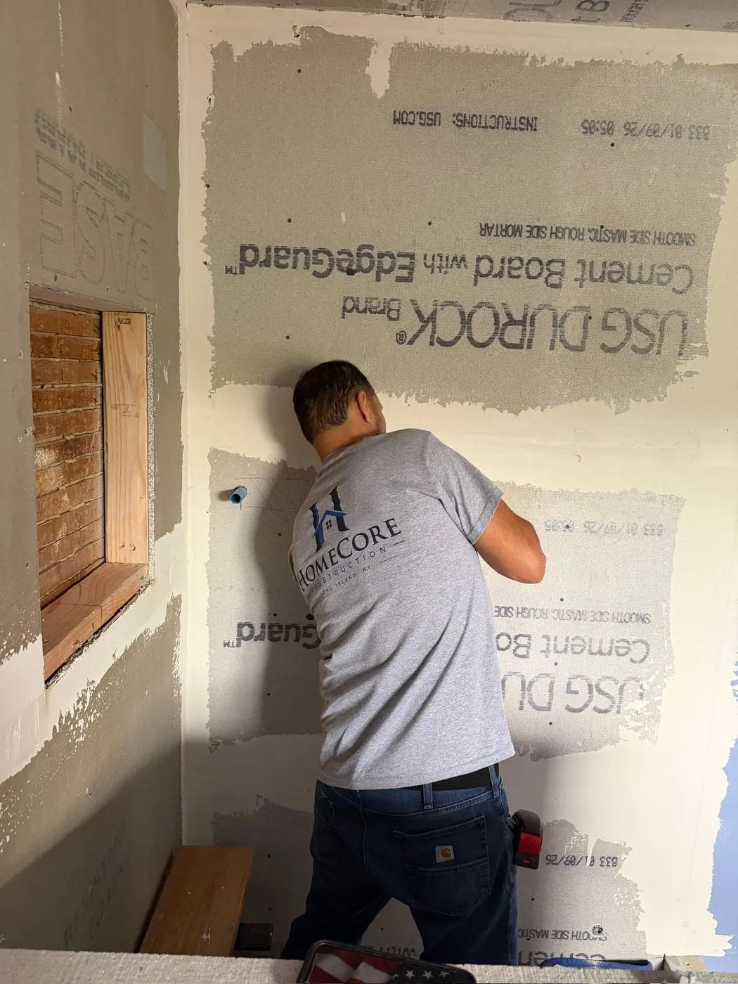 Cement board in the shower: USG Durock cement board going up on the shower walls.