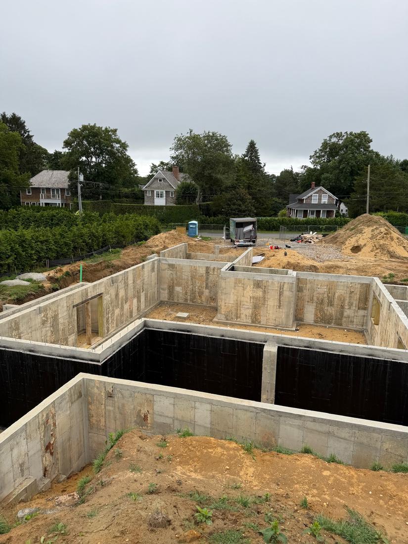 Full basement: Foundation walls around the full basement, with black waterproofing on the walls.