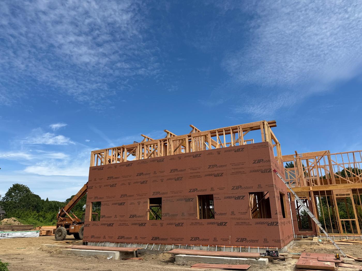 ZIP System sheathing: Red ZIP System panels on the first floor walls as second floor framing begins.