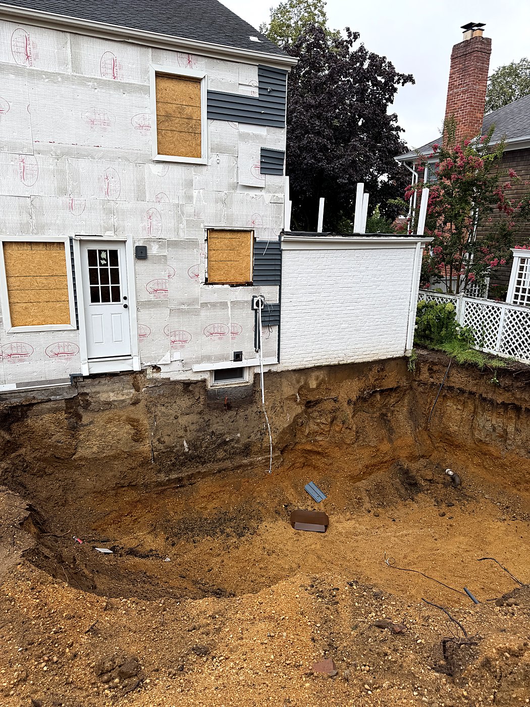 Excavation alongside the house to pour the new foundation