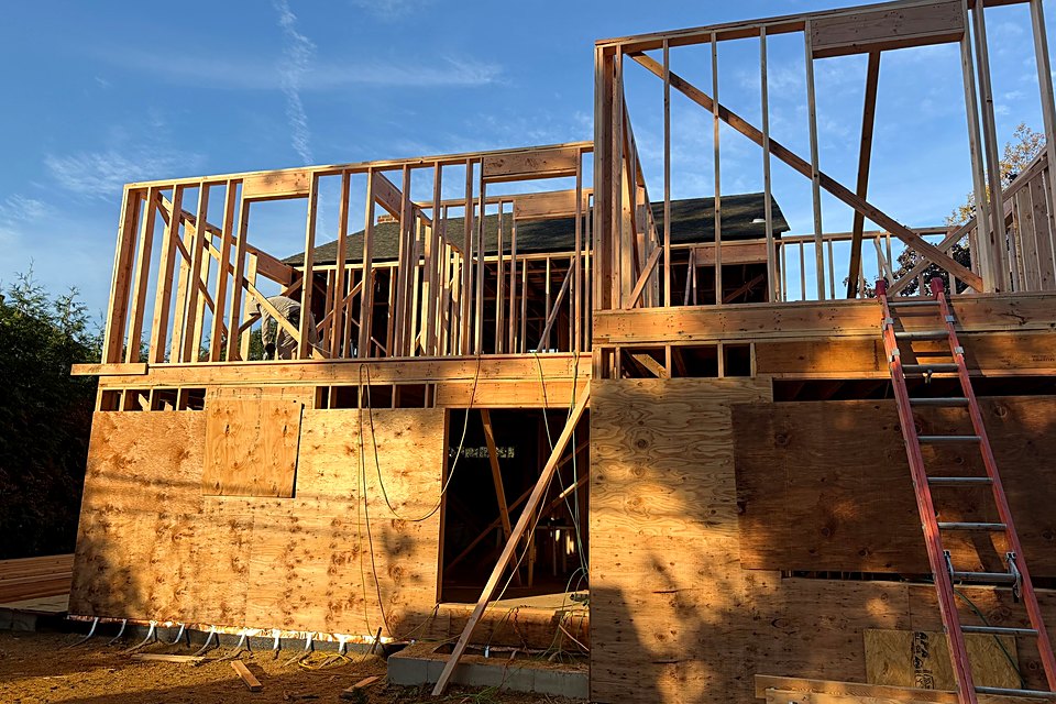 Second floor walls framed above the sheathed first floor