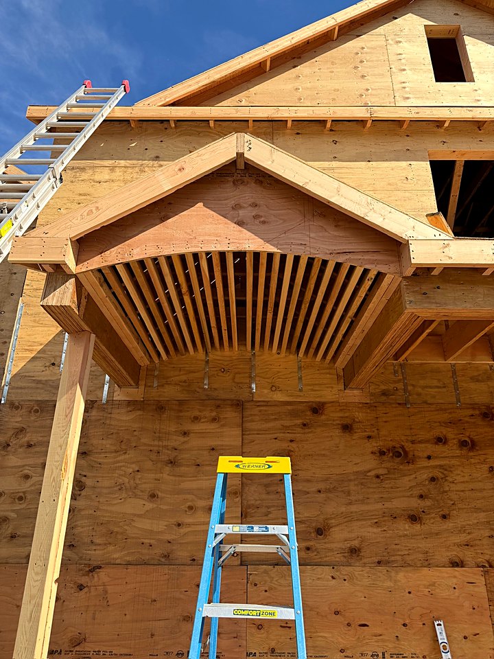 Framing for the new front entry roof beneath the gable