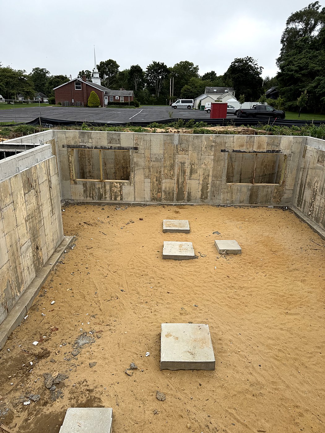 Inside the new foundation with footings set for the custom home