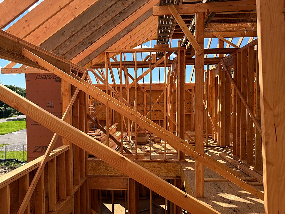 Roof rafters and second floor framing seen from inside a custom home