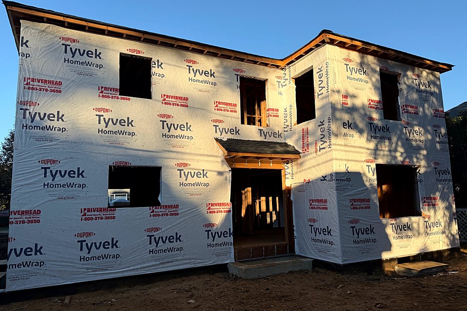 Back of the custom home fully wrapped in Tyvek HomeWrap