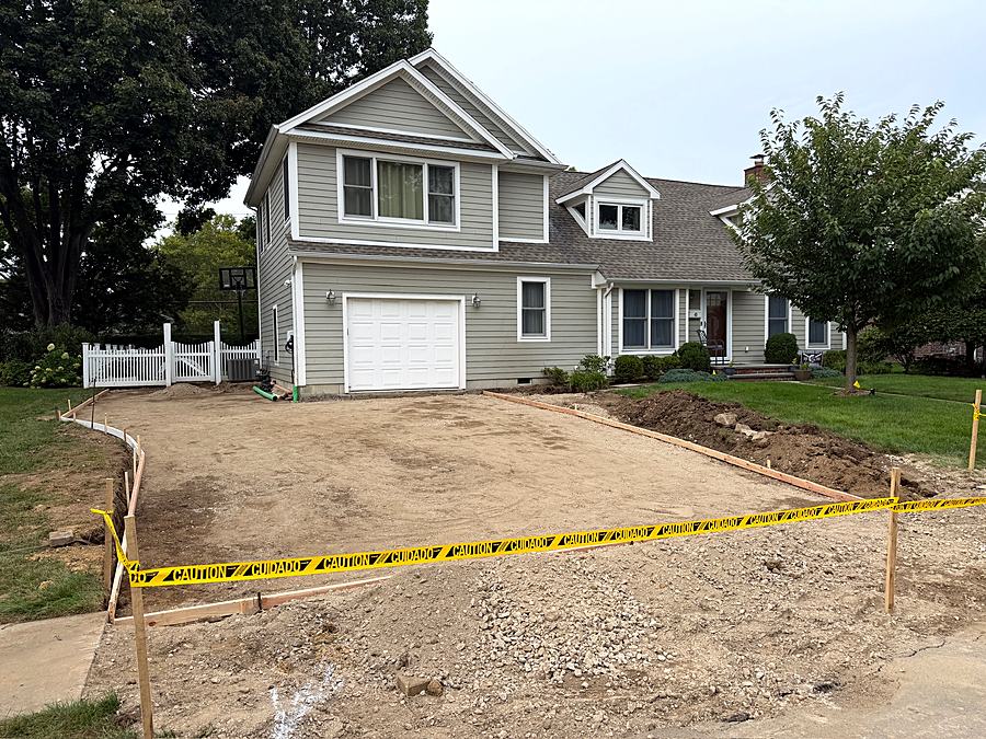 Driveway area excavated and graded down to a compacted base