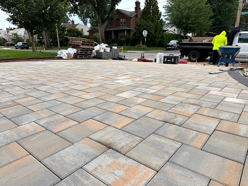 Wide view of the finished paver driveway and walkway