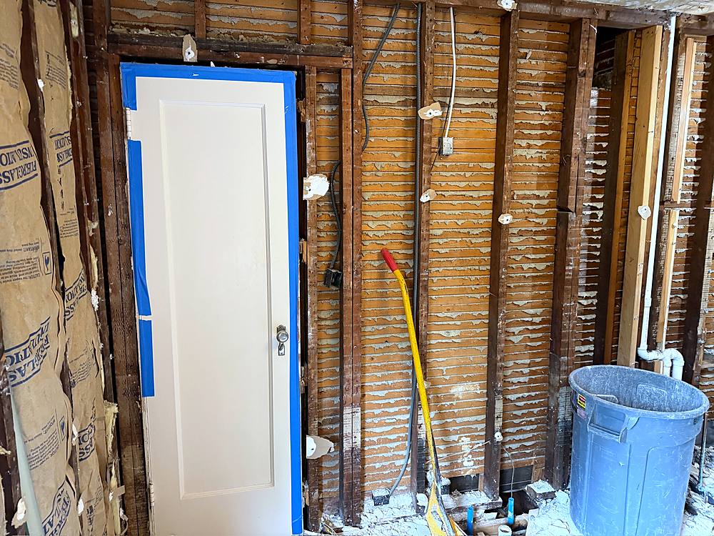 Bathroom gutted back to the original studs and lath