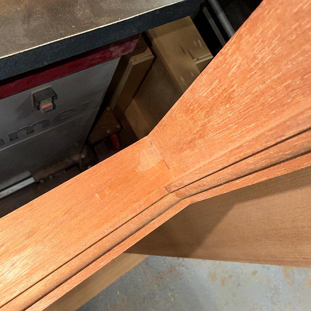 Close-up of the molded profile machined along a door rail
