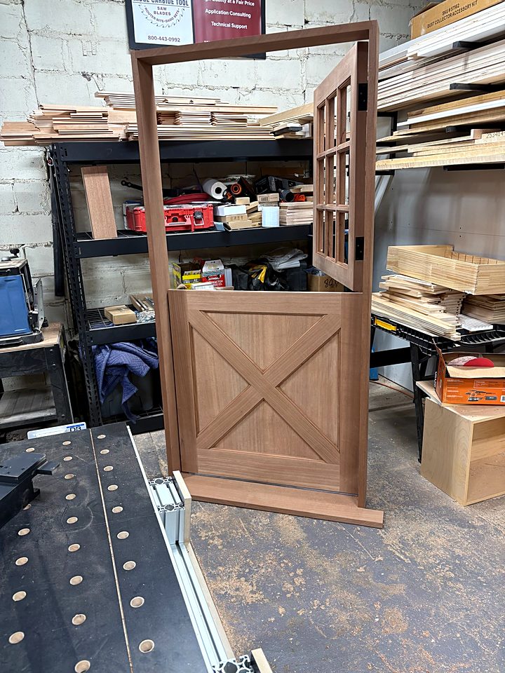 Solid wood Dutch door with a cross-buck lower panel, built in our shop