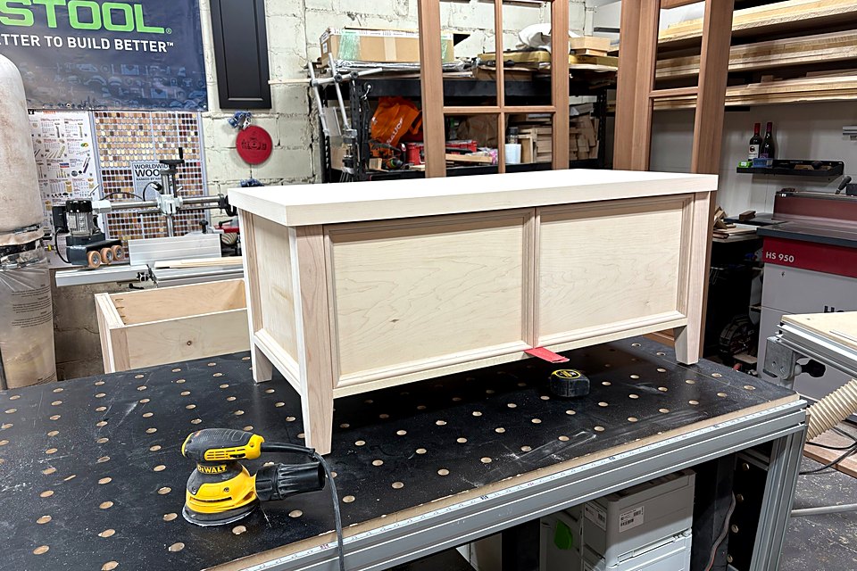 Small paneled cabinet on the shop bench, ready for finish