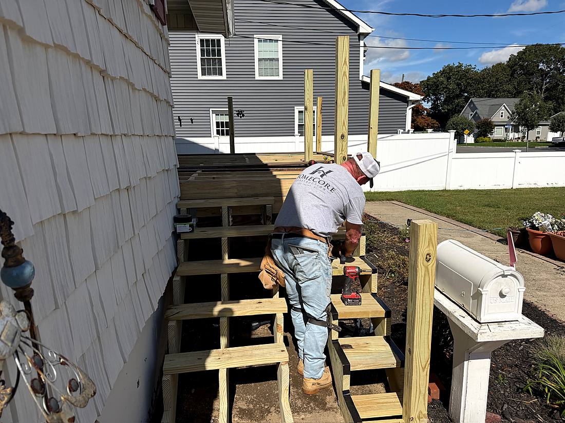 Crew member building the new porch steps