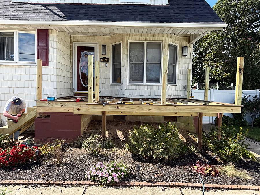 Framed front porch with the posts set and the deck framing in place