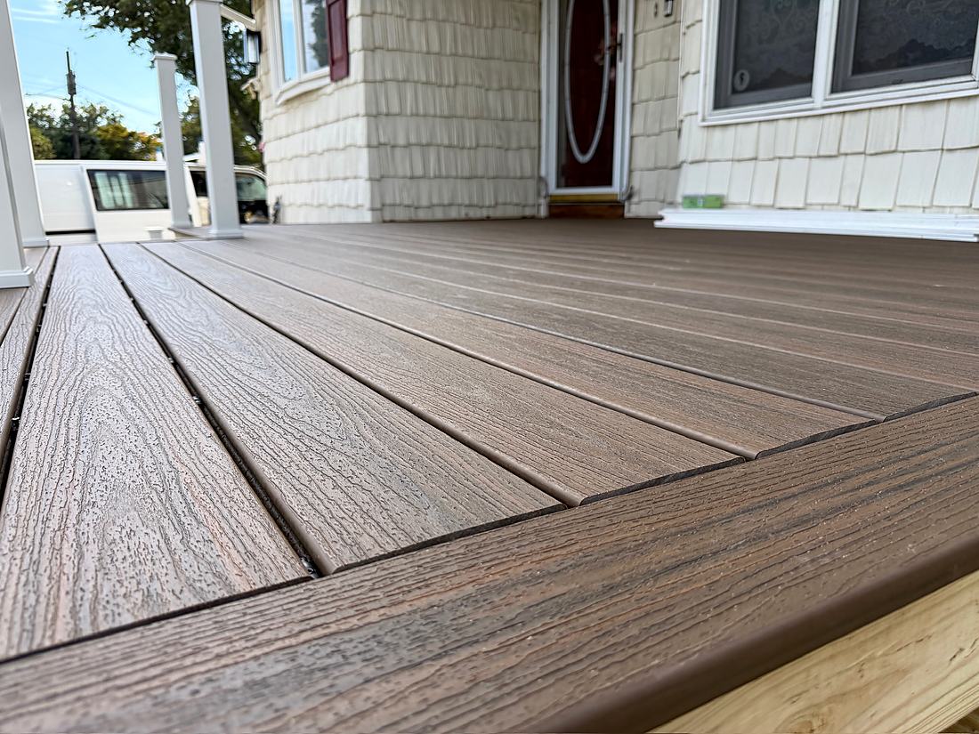 Composite decking boards going down on the new porch