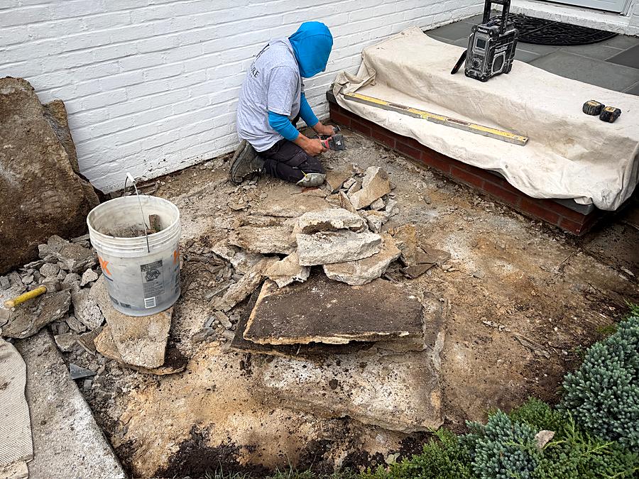 Old stoop broken out and the base prepped for new bluestone