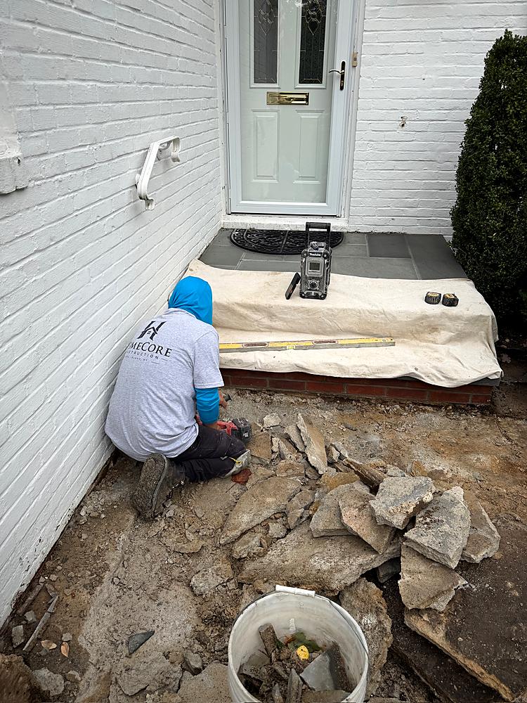 Crew member setting the new bluestone treads