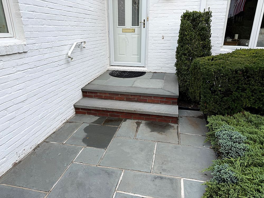 Finished bluestone entry steps with brick risers