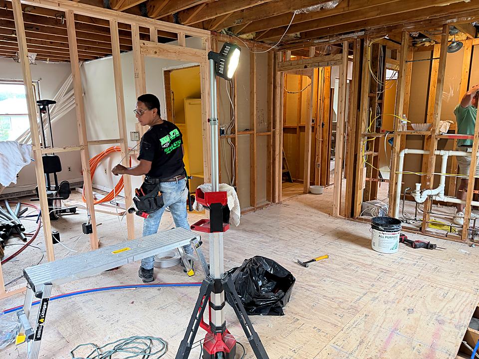 Framed walls with new plumbing roughed in and a carpenter on site